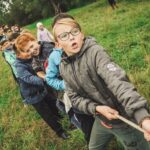 Bunch of kids playing tug of war